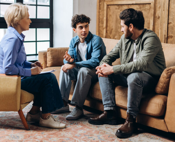 Parent and child in family therapy session under New Jersey custody law